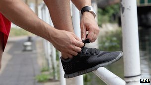_70209468_close_up_of_runner_tying_laces-spl-1.jpg