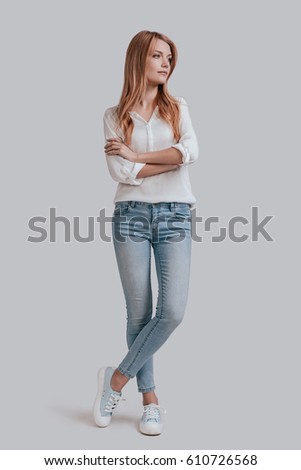 stock-photo-thinking-about-full-length-of-beautiful-young-woman-in-casual-wear-keeping-arms-crossed-and-610726568.jpg