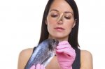 Woman-holding-a-raw-fish.jpg
