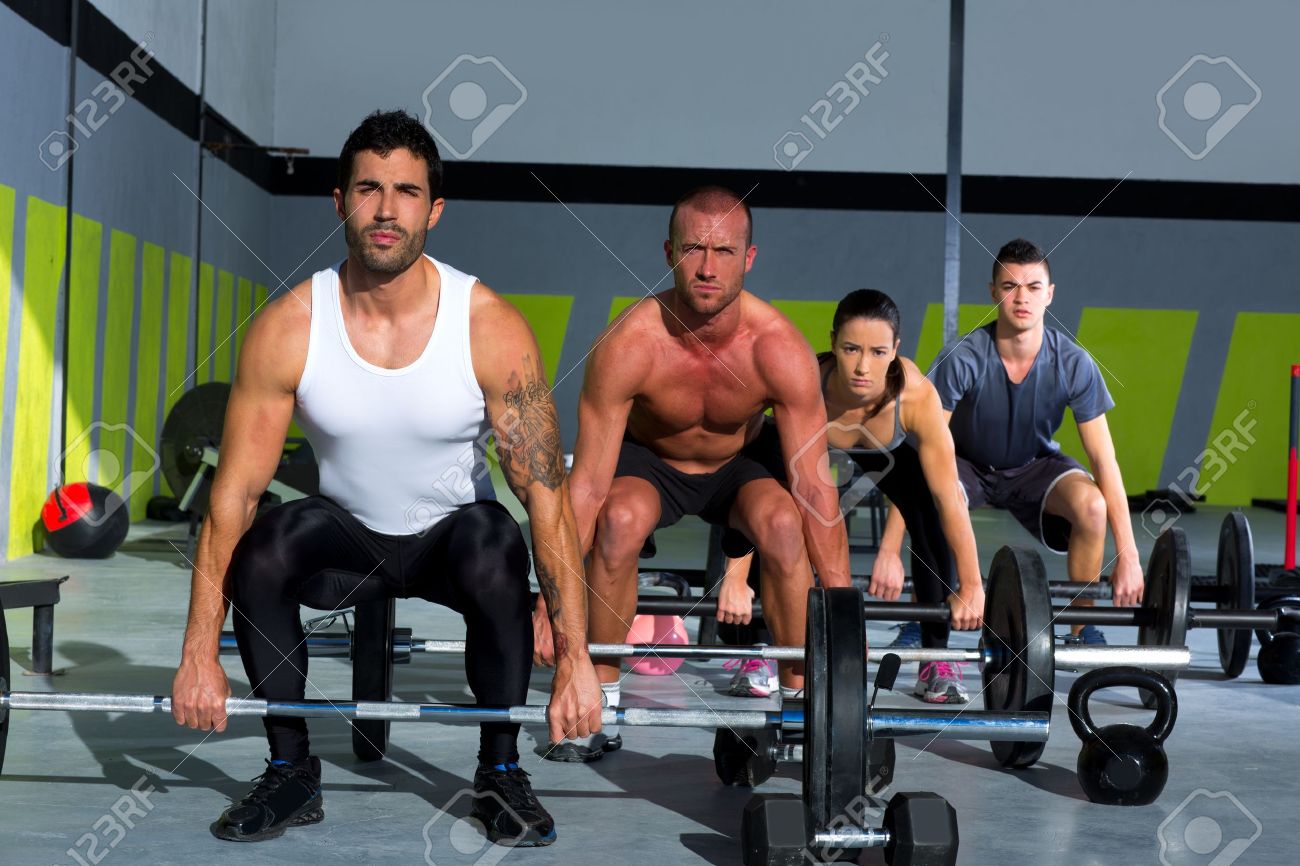 17050581-gym-group-with-weight-lifting-bar-workout-in-crossfit-exercise-Stock-Photo.jpg